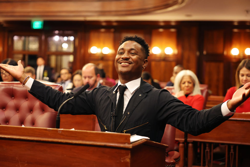  Council member Chi Ossé celebrates the passing of his bill during a City Council meeting at City Hall on November 13, 2024 in New York City. The NYC City Council held a series of votes that included the Fairness in Apartment Rentals Act, which requires whomever hired the real estate broker to pay the fee, essentially freeing renters from paying broker fees. The bill which was sponsored by Council member Ossé, passed by a 42-8 vote