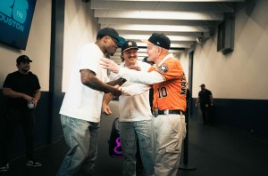 Andre Johnson, Morgan Wallen and Jim “Mattress Mack” McIngvale backstage before opening night of the I'm the Problem Tour at NRG Stadium in Houston, Texas, on June 20.