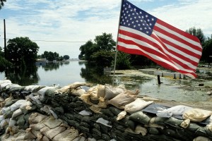 An American flag left on a sand bag levee. The levee holds back the flooding Mississippi River during the worst floods in the mid-West in decades. Photo taken in August 1993.
