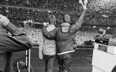 Oasis' Noel and Liam Gallagher walk out to perform at Principality Stadium in Cardiff, Wales, for night 1 of their Oasis Live '25 Tour on Friday, July 4, 2025.